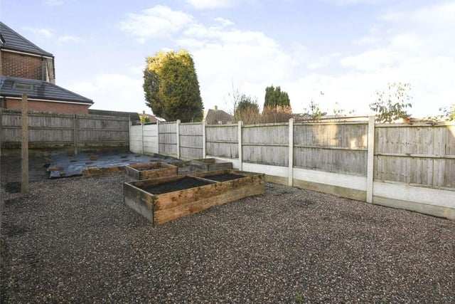 The garden at the back of the £200,000 property is mainly paved, with raised beds.