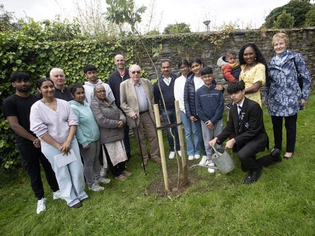 TREE PLANTING IN MEMORY OF REUVEN AND JOSEPH. . . .St. Columb's Park on Saturday saw the planting of three trees in memory of two young men from the Kerala community, Reuven Simon and Joseph Sebastian, who died after getting into difficulty at Enagh Lough in Derry in August, 2022. The tree planting, oganised by Enagh Seniors Group saw the Mayor, Lilian Seenoi-Barr join the families, local clergy and former school friends of the boys from St. Columb's College. (Photos: Jim McCafferty Photography)
