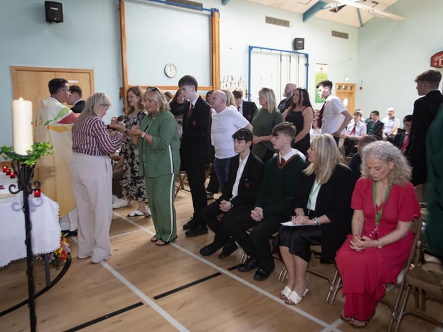 Communion being served at Wednesday's Year 12 Leavers Mass at St. Joseph's Boys School. : .
