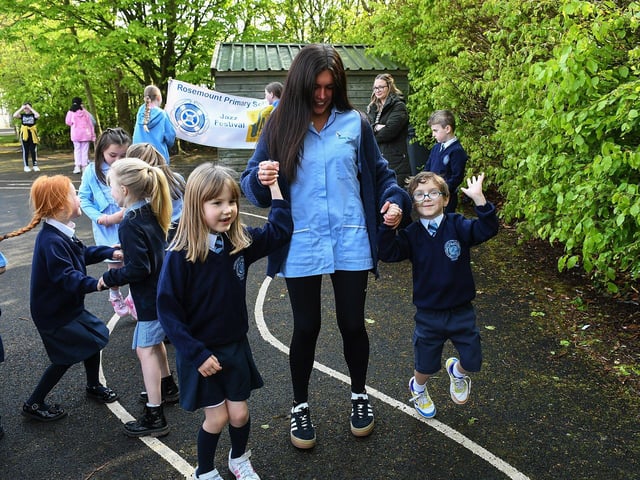Staff member with pupils at the Jive Aces performance at Rosemount Primary School on Thursday morning. Photo: George Sweeney