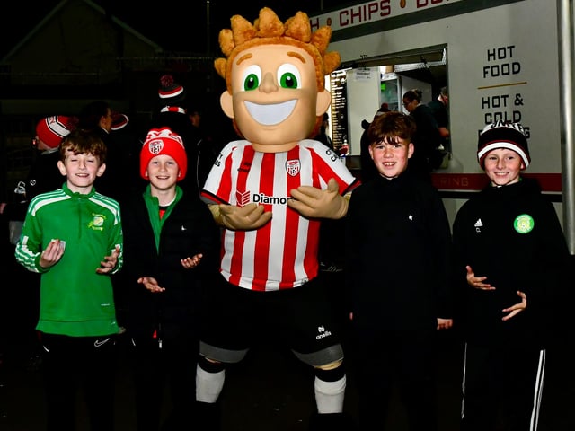 These young Derry fans pose for a photograph with the Candy Stripe Kid.