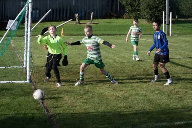 The Oxford netminder watches this shot go wide of the upright despite a deflection, during Sunday's game against Top of the Hill Celtic in the Sean O'Kane Memorial Tournament at St. Joseph's Boys School. (Photos: Jim McCafferty Photography)