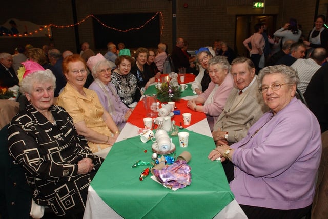 Guests at the Pilots Row Senior Citizens Christmas party enjoy the seasonal atmosphere. (0912PG24)                              :Christmas parties for Derry's senior citizens in December 2003