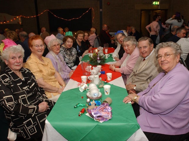 Guests at the Pilots Row Senior Citizens Christmas party enjoy the seasonal atmosphere. (0912PG24) :Christmas parties for Derry's senior citizens in December 2003