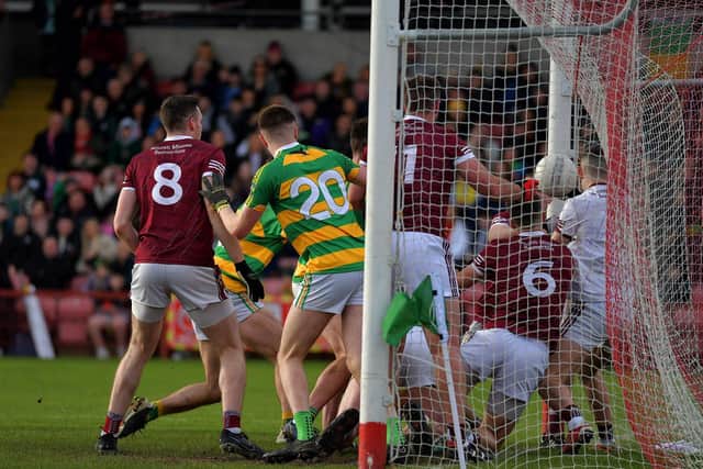 Glenullin’s Neill McNicholl (hidden) forces the ball over the line to score a goal against Banagher during Sunday afternoon’s IFC final in Celtic. Photo: George Sweeney