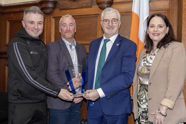 Cathaoirleach of Donegal County Council, Colr Niamh Kennedy and Chief Executive John G. McLaughlin, presenting a memento to Chris English (Chairperson) and Daniel McCauley (Manager). NorthWest Newspix