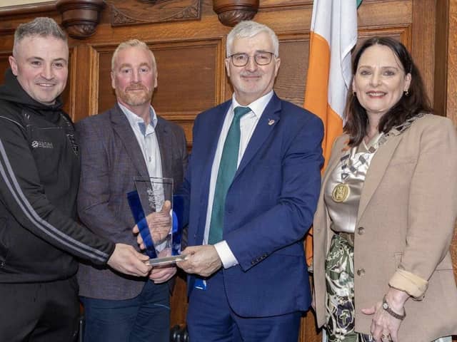 Cathaoirleach of Donegal County Council, Colr Niamh Kennedy and Chief Executive John G. McLaughlin, presenting a memento to Chris English (Chairperson) and Daniel McCauley (Manager). NorthWest Newspix