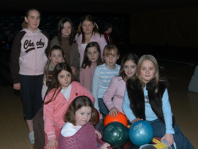 Anna celebrating her birthday with family and friends at the bowling alley.