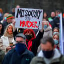 Rebecca Allen holds a placard at the vigil for Ashling Murphy held at the Guildhall Steps in 2022. Photo: George Sweeney.  DER2202GS – 086
