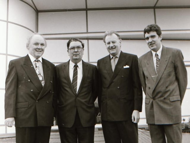 John Hume with others at the Seagate Jobs announcement.