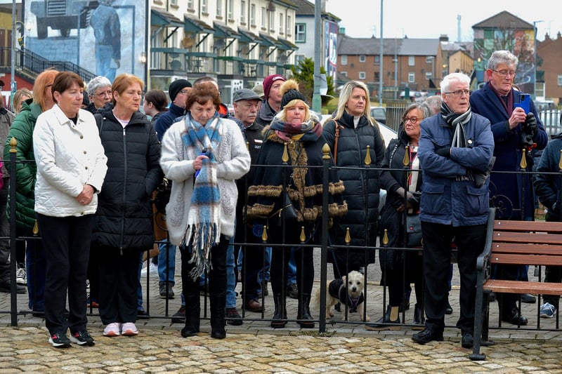 Relatives are joined by people at the Bloody Sunday monument at Joseph's Place on Monday afternoon for a one minute silence on the 51st anniversary of the Bloody Sunday massacre. Photo: George Sweeney. DER2306GS 40