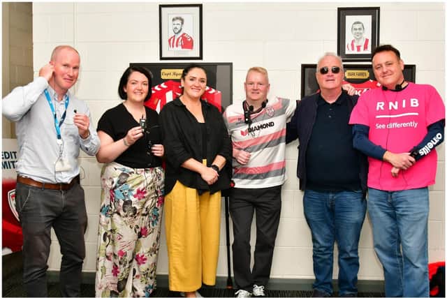 Checking out the headsets which visually impaired or blind spectators attending Derry City games at the Ryan McBride Brandywell Stadium can now avail of are: Steve Setterfield, Leisure Area Manager DCSDC; Councillors Emma McGinley and Aisling Hutton; local RNIB volunteer Rory McCartney; Richard Moore from Derry’s Drive 105; and Michéal Smith, Campaigns Officer for RNIB Northern Ireland.