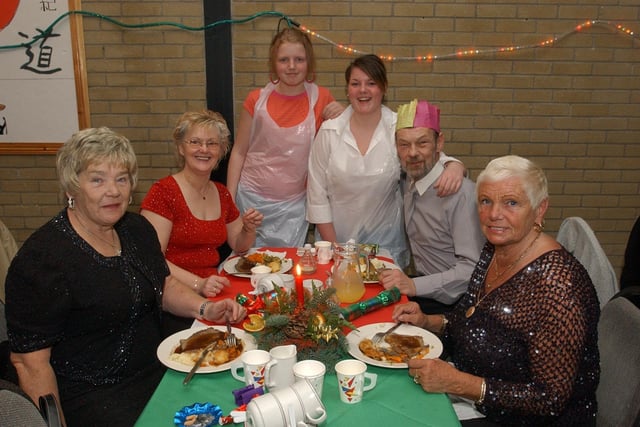 From left, Annie O'Neill, Marie McColgan, Amber Hastings, Kerry Mitchell, John McLaughlin, and Anna McShane. (0912PG22)                               :Christmas parties for Derry's senior citizens in December 2003