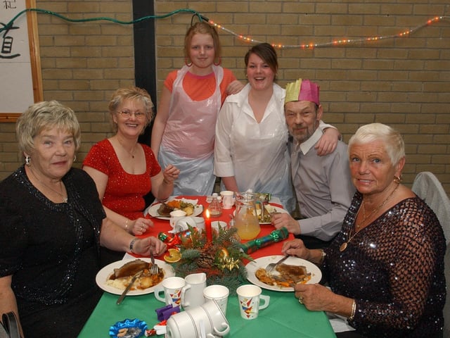 From left, Annie O'Neill, Marie McColgan, Amber Hastings, Kerry Mitchell, John McLaughlin, and Anna McShane. (0912PG22) :Christmas parties for Derry's senior citizens in December 2003