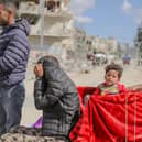 Displaced Palestinians who left Rafah in the southern Gaza Strip following an evacuation order by the Israeli army, arrive at Khan Yunis with their belongings on May 6, 2024. On the same day, Hamas announced it had accepted a truce proposal. (Photo by Khames Alrefi / Middle East Images / Middle East Images via AFP) (Photo by KHAMES ALREFI/Middle East Images/AFP via Getty Images)