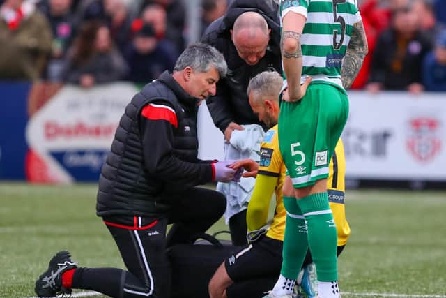 Shamrock Rovers goalkeeper Alan Mannus is treated by the doctor after dislocating his finger against Derry at Brandywell. Photo by Kevin Moore.