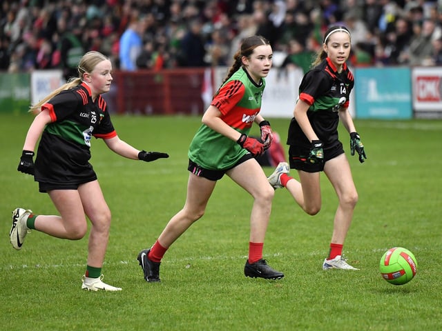 Young footballers from Doire Trasna and Slaughtmanus Under 12 teams play at half-time at the Derry Junior Football Championship Final held in Celtic Park on Sunday afternoon. Photo: George Sweeney