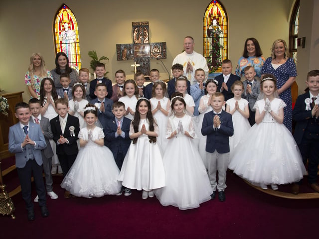 Pupils from St. Paul’s PS, Slievemore pictured after receiving the Sacrament of First Holy Communion from Fr. Sean O’Donnell at St. Joseph’s Church, Galliagh on Friday afternoon last. Inlcuded are Caitlin McGuinness, Classroom Assistant, Rachel Lynch, P4 Teacher, Roisin Logue, P4 Teacher and Catherine Green, Classroom Assistant. (Photos: Jim McCafferty Photography)