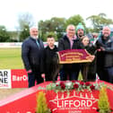 Northwest Supplies A2/A3 winner 'Pivatol Time' with competition sponsor JP Briggs (on right) presenting Cora Mc Clelland with the winner’s trophy on behalf of winning owner Kelmore McConaghie. Beside her is her father Darren Mc Clelland.  Included is Spencer Saberton, RM at Lifford Stadium, Neil McBride (NWGOBA) and kids, Rio Eakin, Freya Hall and Belle Eakin.