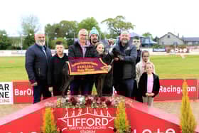 Northwest Supplies A2/A3 winner 'Pivatol Time' with competition sponsor JP Briggs (on right) presenting Cora Mc Clelland with the winner’s trophy on behalf of winning owner Kelmore McConaghie. Beside her is her father Darren Mc Clelland.  Included is Spencer Saberton, RM at Lifford Stadium, Neil McBride (NWGOBA) and kids, Rio Eakin, Freya Hall and Belle Eakin.