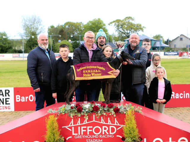 Northwest Supplies A2/A3 winner 'Pivatol Time' with competition sponsor JP Briggs (on right) presenting Cora Mc Clelland with the winner’s trophy on behalf of winning owner Kelmore McConaghie. Beside her is her father Darren Mc Clelland.  Included is Spencer Saberton, RM at Lifford Stadium, Neil McBride (NWGOBA) and kids, Rio Eakin, Freya Hall and Belle Eakin.