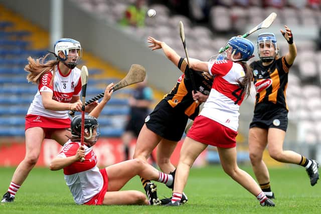 Kilkenny's Therese Donnelly is tackled by Sinead McGill of Derry during the 2023 Glen Dimplex All-Ireland Intermediate Camogie Championship Semi-Final in FBD Semple Stadium, Tipperary. (©INPHO/Laszlo Geczo)