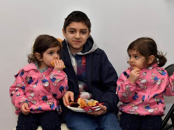 Enjoying some food at the North West Islamic Association’s Tea and Tour day in Pennyburn on Sunday last. Photo: George Sweeney. DER2311GS – 03