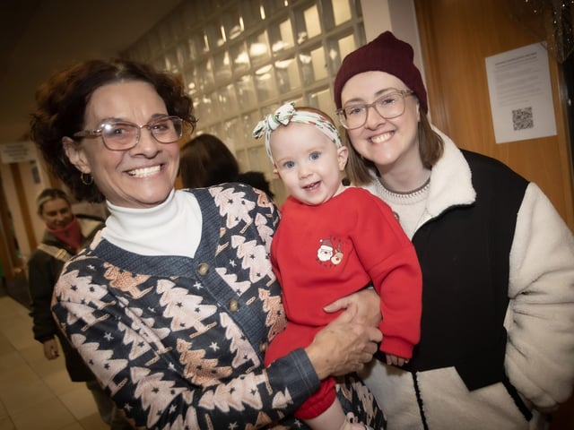 Retiriing Derry Credit Union Education and Training Officer Mary Crumley pictured at Santa Saturday with her daughter and granddaughter. : .