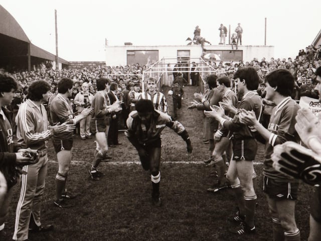 Players, club officials and staff and fans as Derry City FC face Finn Harps FC at Ballybofey in their first league meeting.