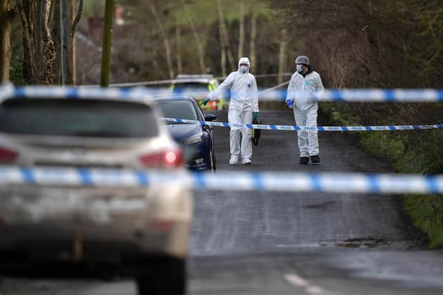 OMAGH, NORTHERN IRELAND - FEBRUARY 23: Police and forensics are seen at the scene of last Wednesday's shooting of a high profile PSNI officer at the Youth Sports Centre on February 23, 2023 in Omagh, Northern Ireland. The senior police officer, named as Detective Chief Inspector John Caldwell was shot four times as he put footballs into the boot of his car as he stood along side his son following a football training session. The PSNI have said that the "primary focus" of the police investigation is the involvement of violent dissident republicans. (Photo by Charles McQuillan/Getty Images)