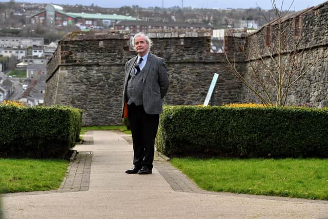 Ulster University lecturer and lawyer John Thompson pictured in the New Life Garden at Bishop Street outer, the site of the execution of Cecily Jackson, who was burned at the stake, in 1725. Photo: George Sweeney
