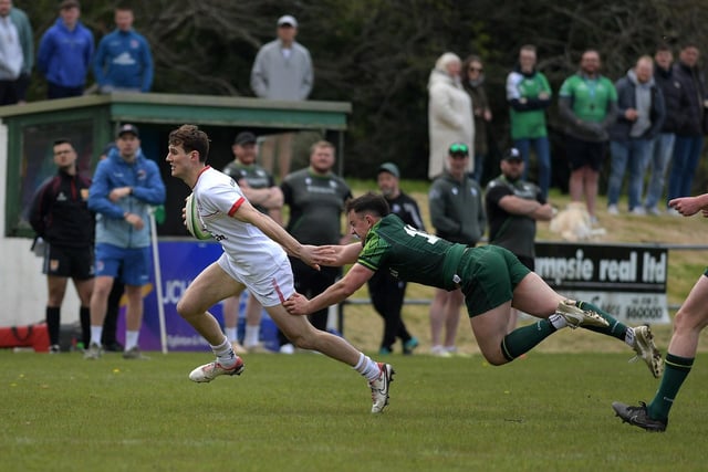 Ulster’s Michael Orr evades a tackle from Connacht’s Barry Walsh. Photo: George Sweeney