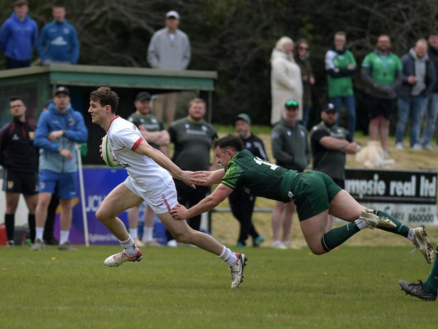 Ulster’s Michael Orr evades a tackle from Connacht’s Barry Walsh. Photo: George Sweeney