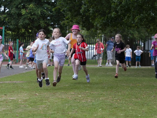 Girls show the boys how to run a race at Greenhaw Primary School’s Annual Sports Day.