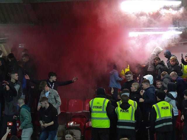 A flare is set of by Derry city supporters. Photograph: George Sweeney