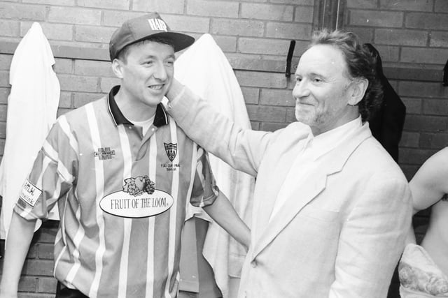 Legends Liam Coyle and Phil Coulter celebrate after the game.