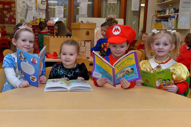 Emily, Olivia, Jake and Jenny celebrate World Book Day at Belmont Nursery School on Racecourse Road. Photo: George Sweeney. DER2310GS – 25