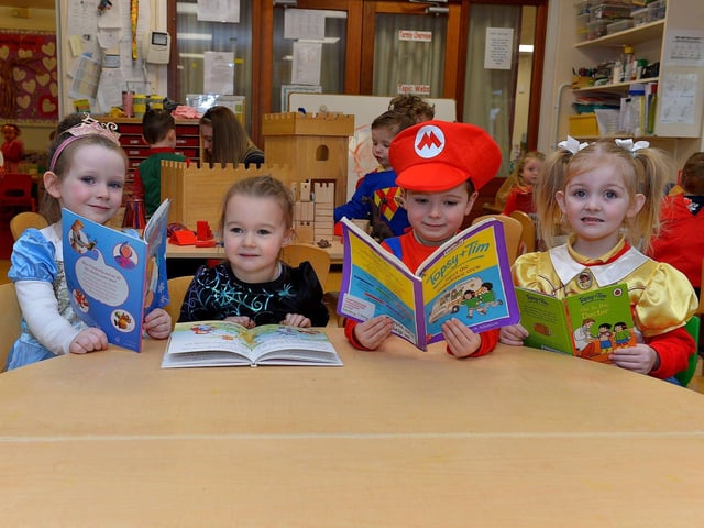 Emily, Olivia, Jake and Jenny celebrate World Book Day at Belmont Nursery School on Racecourse Road. Photo: George Sweeney. DER2310GS – 25