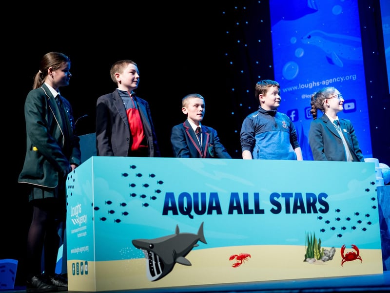 Pupils from St Cecilia's College, Lisneal College, Oakgrove Integrated College, Carndonagh Community School, and Thornhill College participate in the Aqua All Stars game