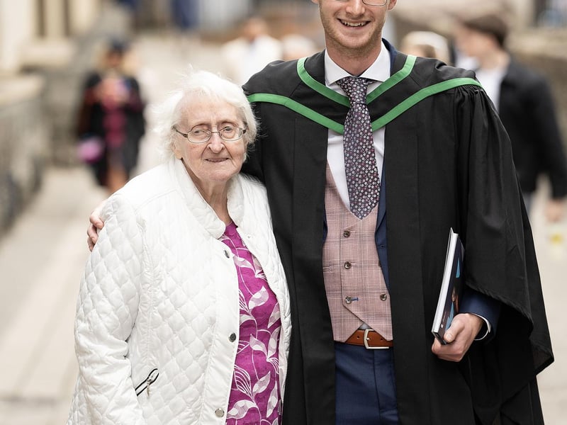 James Weir from Magherafelt celebrates with granny Mildred Weir as he graduates with a degree in Information Technology from Ulster University in Derry on Monday July 8. (Photo: Nigel McDowell / Ulster University)