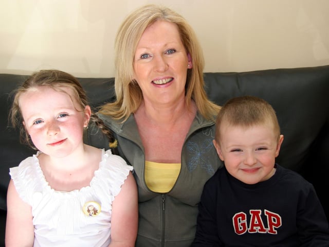 Granny Margaret joins in the birthday celebrations with Caitlin and Caoimhin 0009JML : Parties and celebrations April 2006: Kaitlin Quigg.