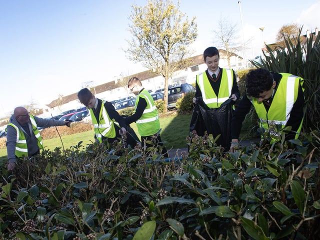 Kevin Campbell working with St. Joseph's students on Wednesday last as they take part in a clean up around the school.