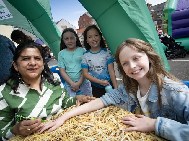 Enjoying the Henna hand painting at the Feile '25s Party in the Park (Big Bog BBQ) in Pilot's Row on Saturday. (Photos: Jim McCafferty Photography) : .