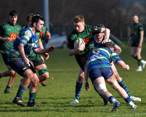 City of Derry’s David Lapsley in the thick of the action against Grosvenor at Judges Road on Saturday. Photo: George Sweeney
