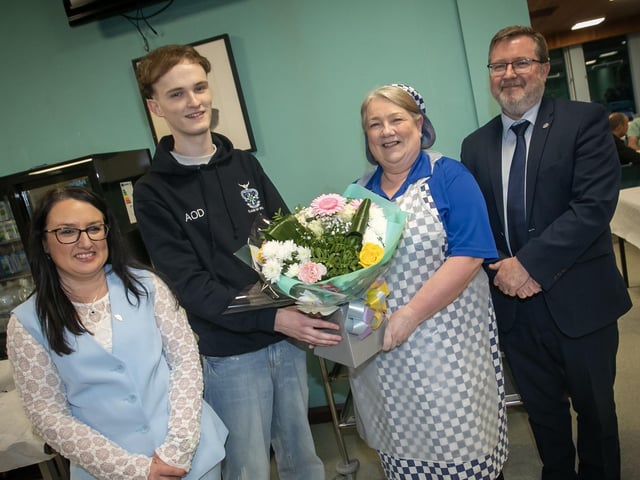 Aaron O'Doherty, Head Boy pictured making a special presentation to Mrs. Paula Kelly on Thursday night. Included in photo is Mrs. Caroline McLaughlin, Principal and Mr. John Johnston, Vice Principal. (Photos; Jim McCafferty Photography) : .