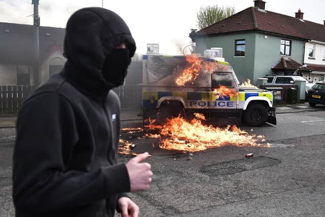 A Police vehicle is attacked with petrol bombs in the Creggan area on April 10, 2023  (Photo by Charles McQuillan/Getty Images)