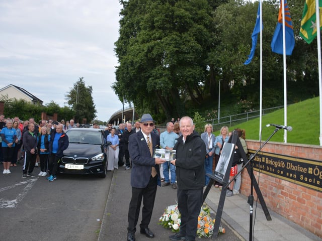 Charlie McMenamin made a presentation to Mickey English, father of Charles