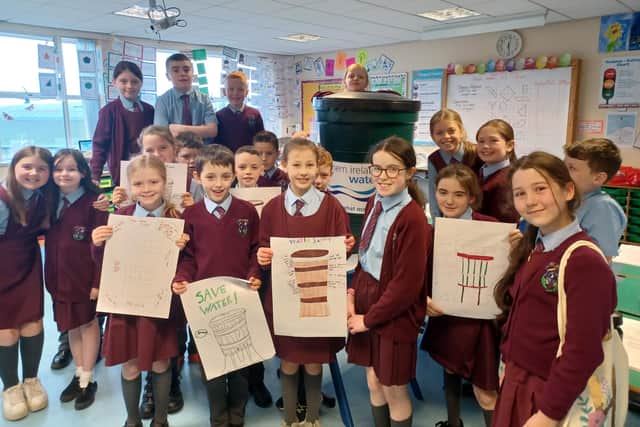 Pictured are pupils from St John’s Primary School with their new Waterbutt.