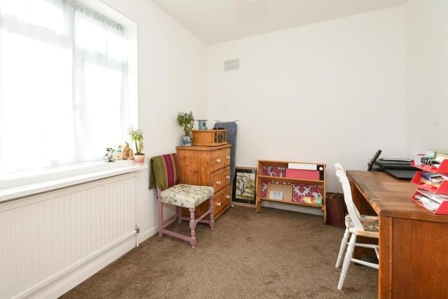 The bright third bedroom could easily be converted into an office if you tend to work from home. Again the floor is carpeted, while the uPVC double-glazed window overlooks the back garden.