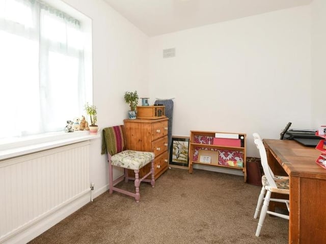 The bright third bedroom could easily be converted into an office if you tend to work from home. Again the floor is carpeted, while the uPVC double-glazed window overlooks the back garden.
